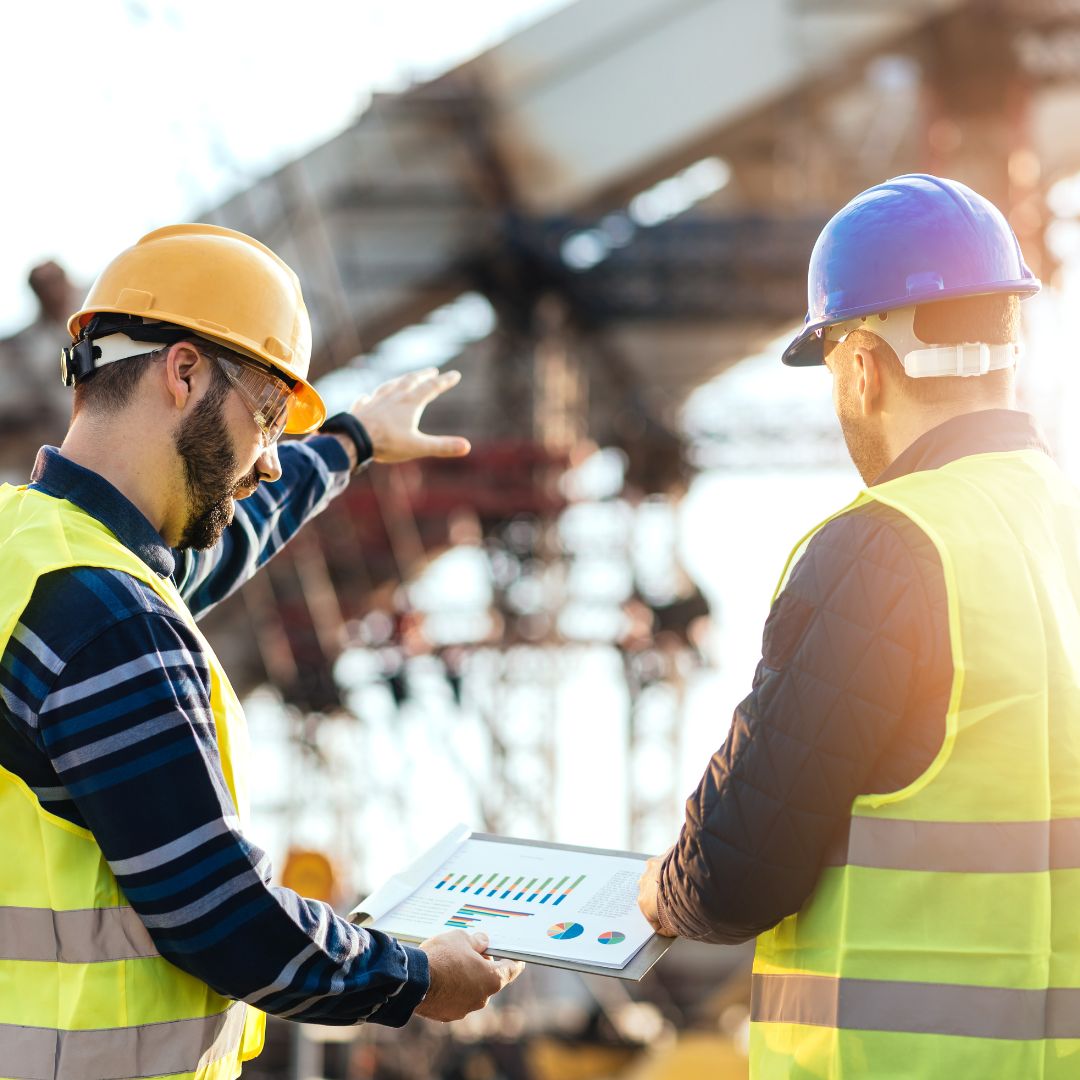 construction working talking over numbers